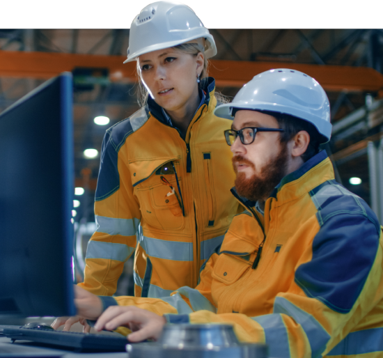 construction workers looking at computer