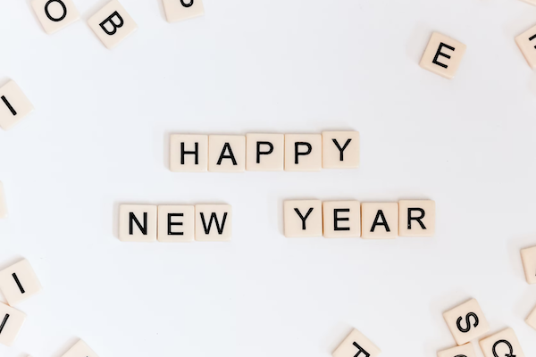 happy new year written out in scrabble pieces