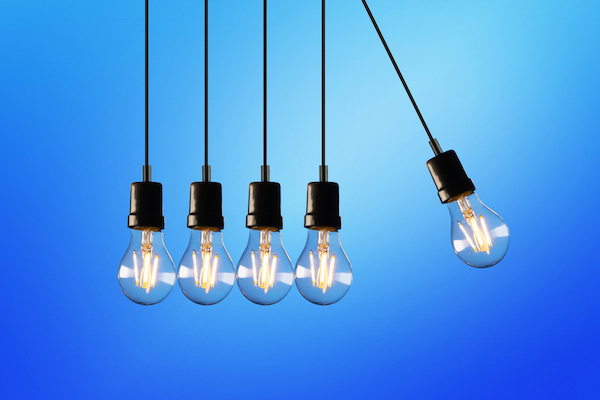 light bulbs arranged as newtons cradle